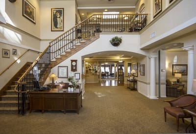 Bright lobby area with stairs and seating