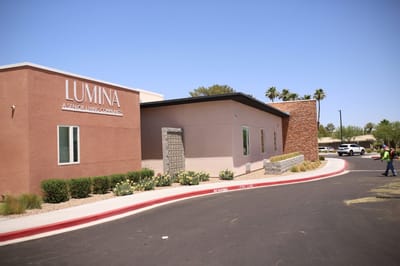Exterior view of Lumina facility with signage