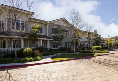 Exterior view of the facility with landscaped grounds