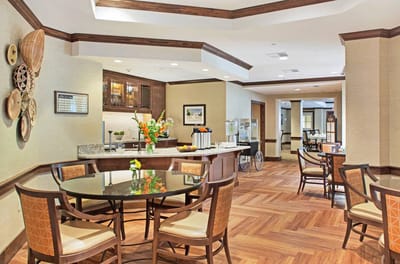 Interior common area with a dining table and kitchen
