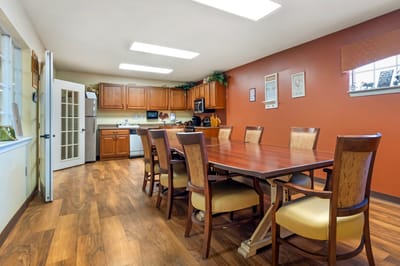 Dining room with a large wooden table and chairs