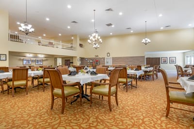 Interior of a dining room with tables and chairs