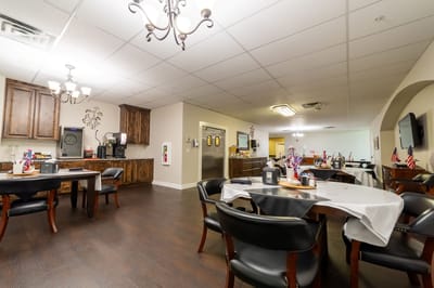 Bright dining room with tables set for a meal