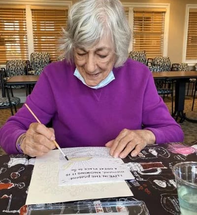 Resident engaging in a coloring activity