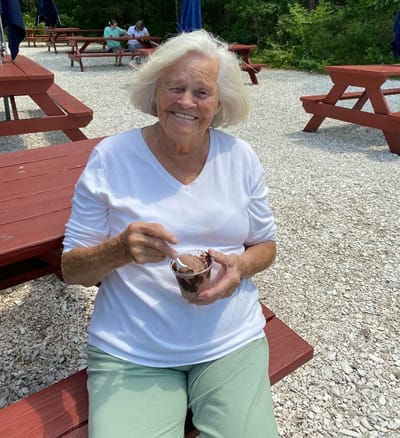 Resident enjoying ice cream outdoors in the garden