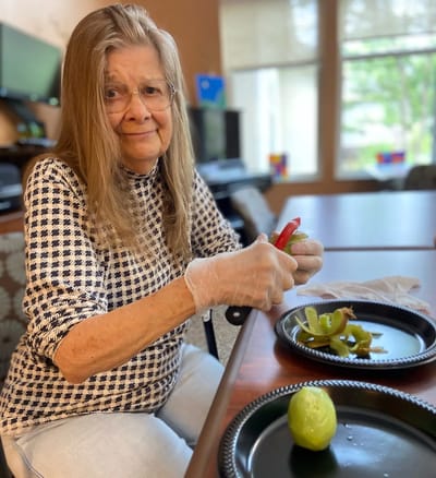 Resident preparing food in an activity room