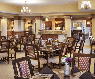Dining area with tables and floral centerpieces
