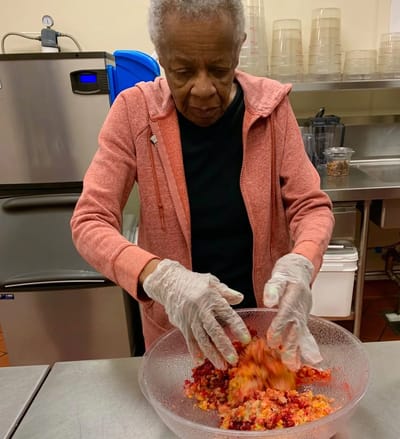 Resident preparing food in the kitchen