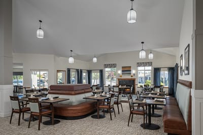 Bright dining room with tables and comfortable seating
