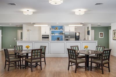Bright dining area with tables and chairs