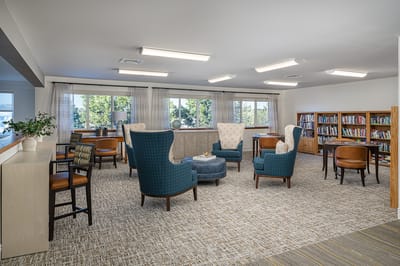 Bright common area with seating and bookshelves
