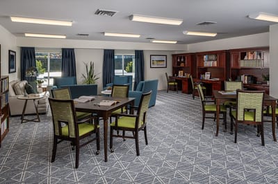 Bright and inviting common area with seating and bookshelves