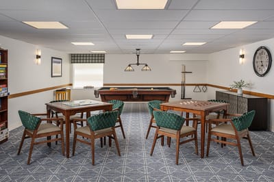 Interior common area with tables and a pool table