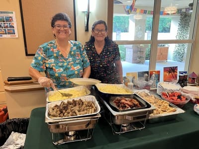 Staff serving food at a community event