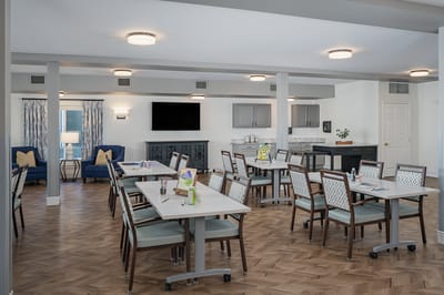 Bright and modern common area with tables and seating