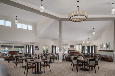 Bright dining room with tables and chairs