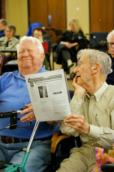 Two residents sharing a moment in a common area