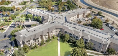 Aerial view of Brookdale Riverwalk with green spaces