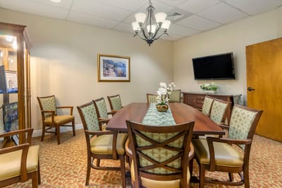 A common area with a dining table and chairs