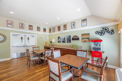 A common area with tables and movie-themed decor