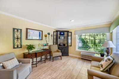 Bright common area with seating and large window
