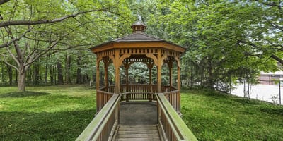 Wooden gazebo in a landscaped outdoor area