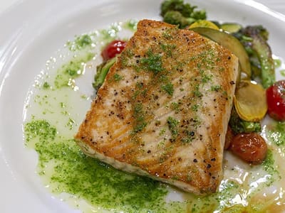 A gourmet meal of salmon with vegetables