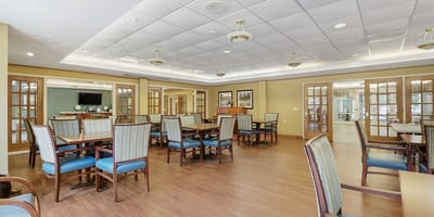 Interior view of a dining room area with tables and chairs