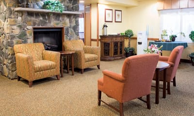 Cozy common area with seating and a fireplace