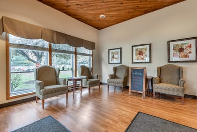 Cozy lounge area with comfortable chairs and artwork