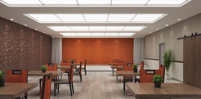 Bright dining area with wooden tables and plants.