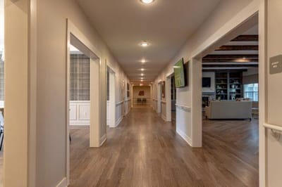 Hallway with common area and seating visible