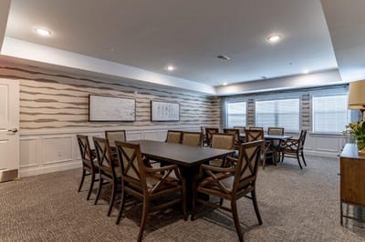 Interior common area with a large table and chairs