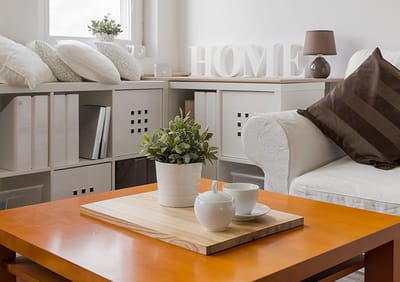 Bright common area with a coffee table and decor