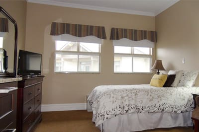 Cozy private room with a bed and dresser