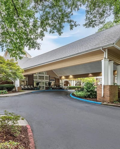 Entrance of Brookdale at Home Roswell with covered area