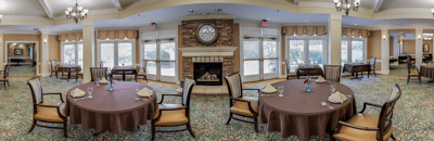 Interior view of a dining room with tables set