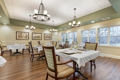 Bright dining room with tables set for meals