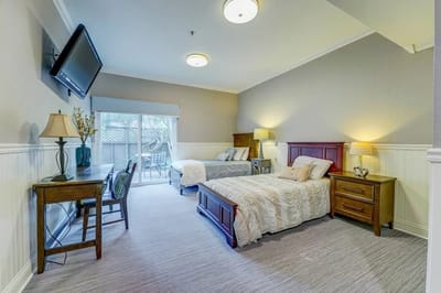 Interior view of a shared resident room with furnishings