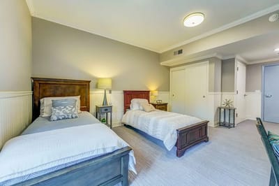 A cozy interior view of a resident room with two beds