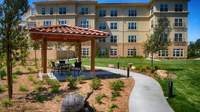 Outdoor seating area with a gazebo and landscaping