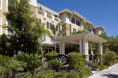 Front entrance of a senior living facility with landscaping