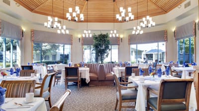 Elegant dining room setup with tables and chairs
