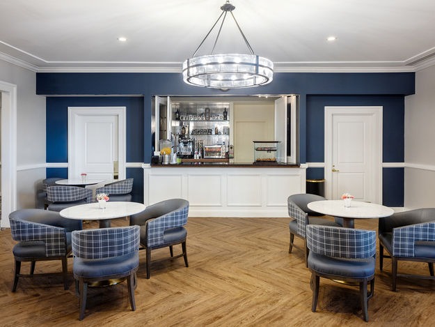 Common area with tables and chairs in a lounge setting