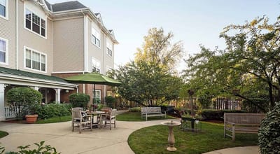 Serene outdoor courtyard with seating and greenery