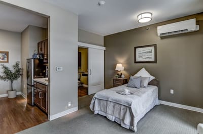 A cozy resident bedroom with modern furnishings