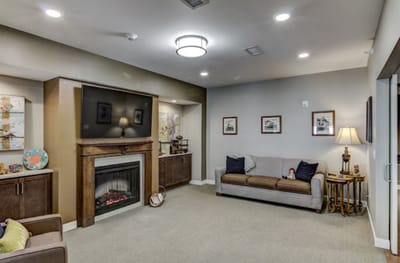 Interior common area with a fireplace and seating