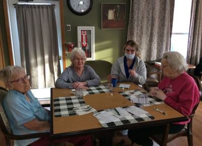 Residents and staff interacting in a communal area