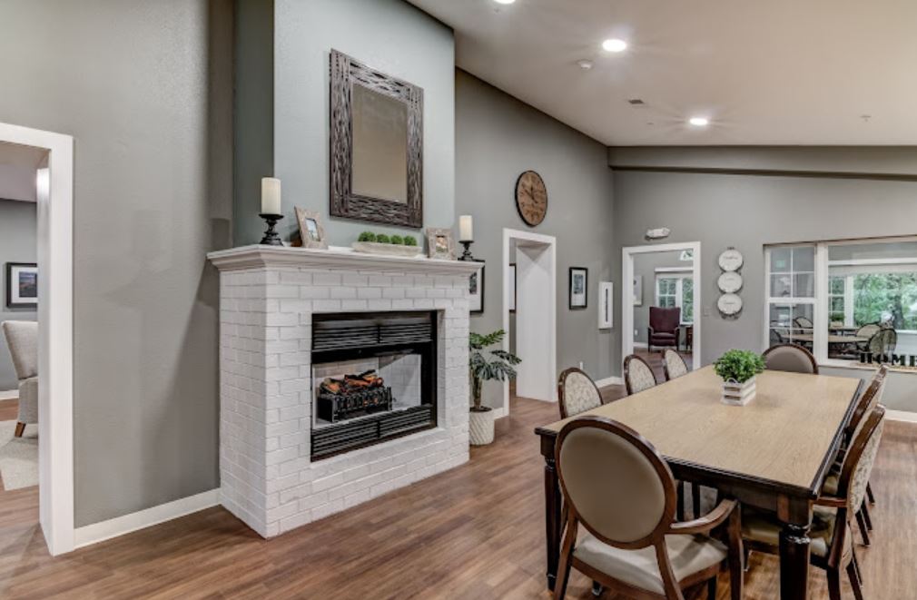 Interior common area with a dining table and fireplace