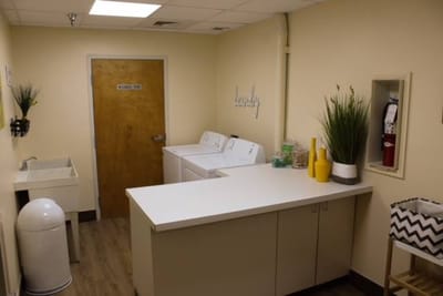 Laundry room with washers and dryers